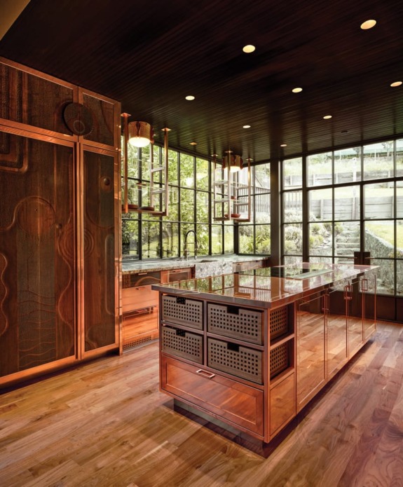 For the kitchen cabinets, Chris French Metal shaped copper sourced from Japan into frames for sculptural wood panels by Tennessee craftsman Caleb Woodard.