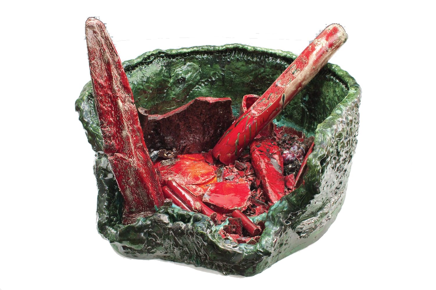 Abstract ceramic sculpture with green textured base and bold red elements on a plain white background.