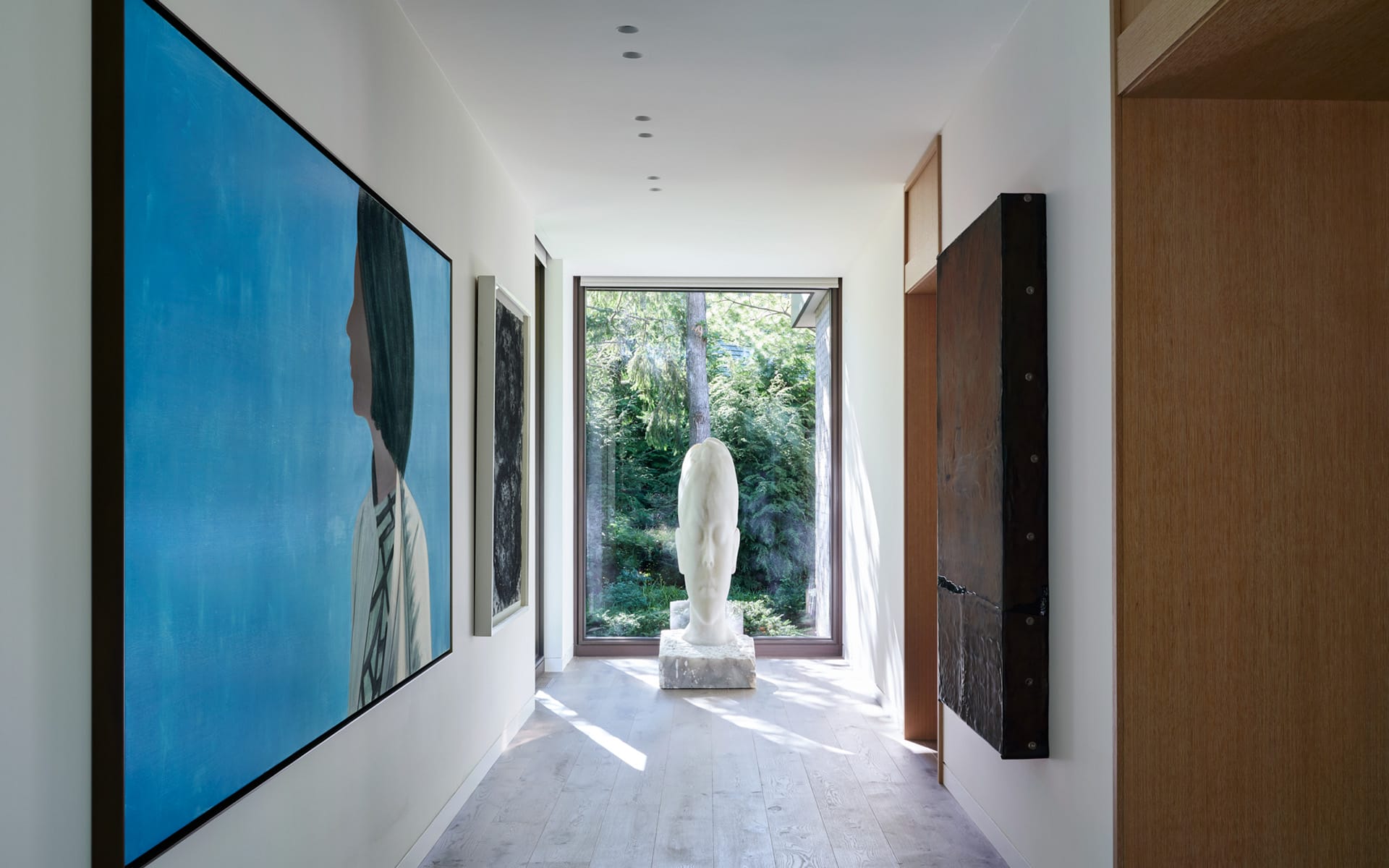 Works by Alex Katz, Jaume Plensa, and Theaster Gates grace the entry hall of the Chicago-area residence, designed by Robbins Architecture and Andrea Goldman.