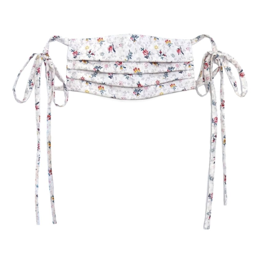 Floral patterned fabric face mask with long tie strings and pleated design on white background