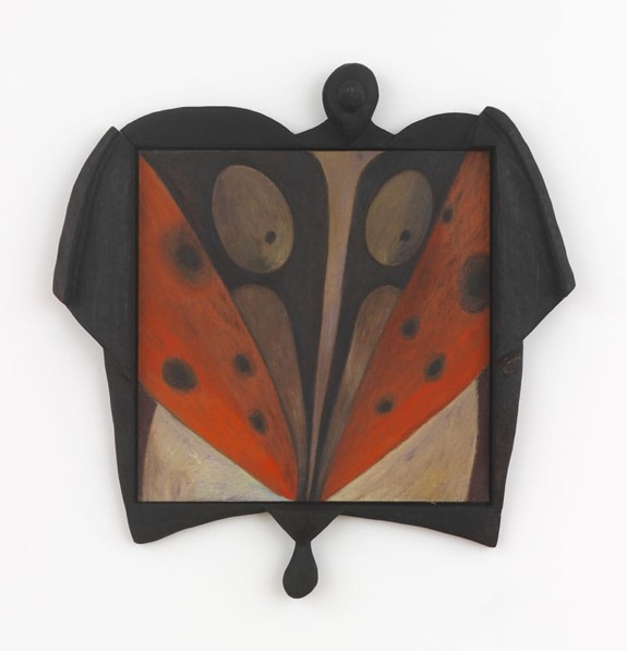 Abstract artwork featuring symmetrical patterns with bold red, black, and beige hues enclosed in a dark frame.