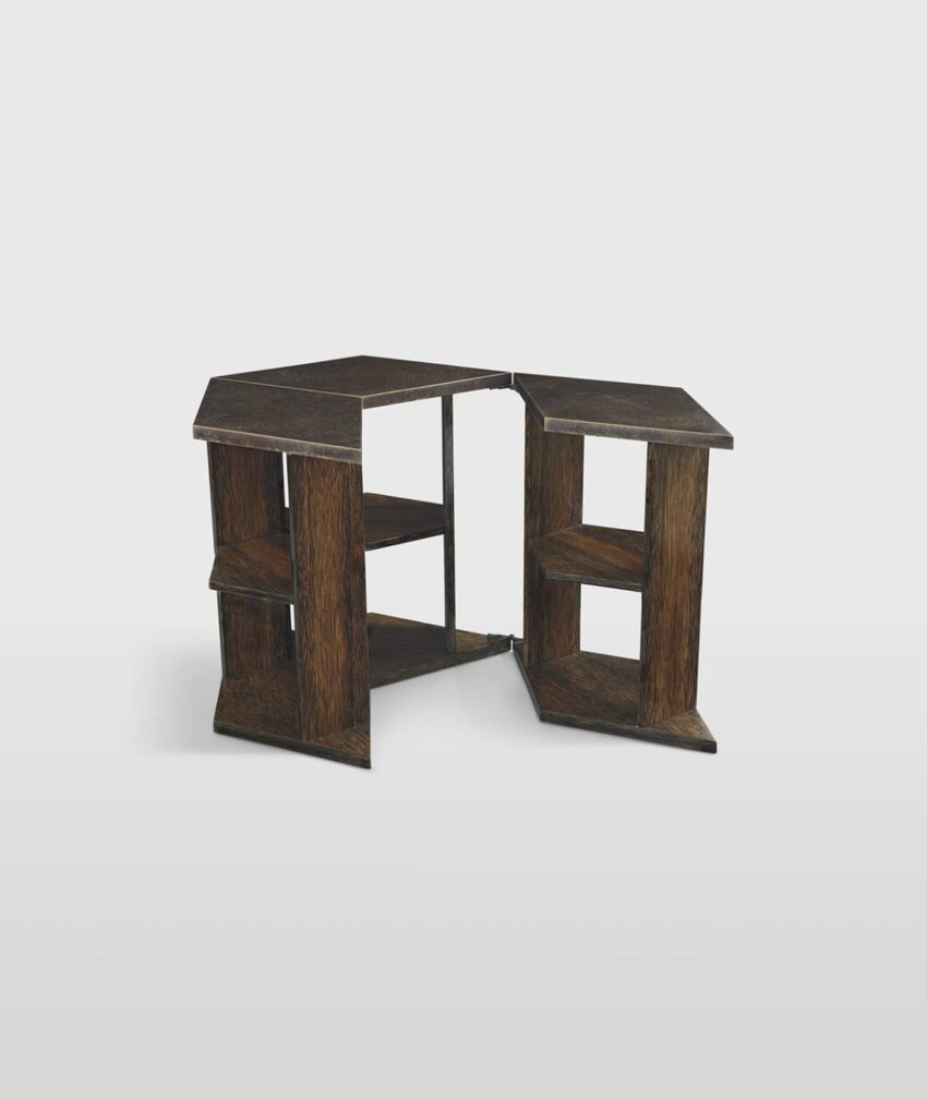 Wooden geometric corner table with built-in shelves, showcasing a modern design and dark finish on a white background.