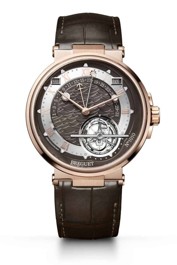 Luxury watch with brown leather strap, gold casing, intricate dial featuring calendar and tourbillon, brand name on face.