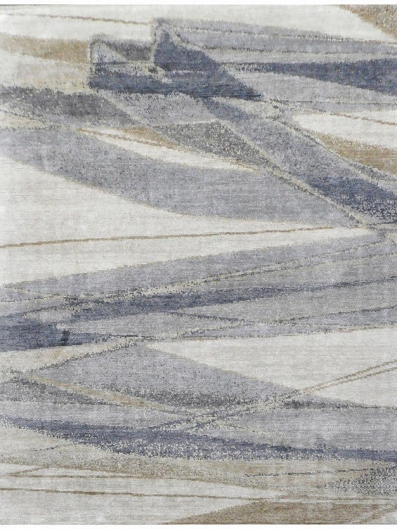 Abstract geometric pattern rug in shades of gray, beige, and blue with overlapping lines and textured design.