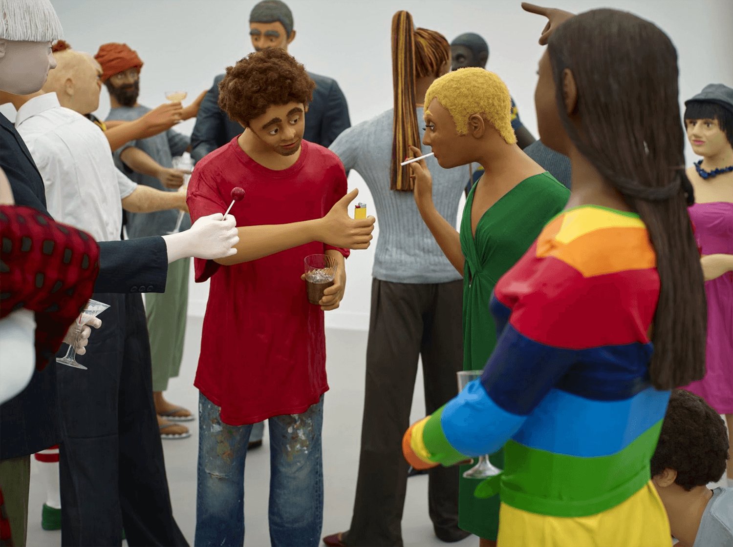 A diverse group of colorful sculpture figures interacting at an art installation.