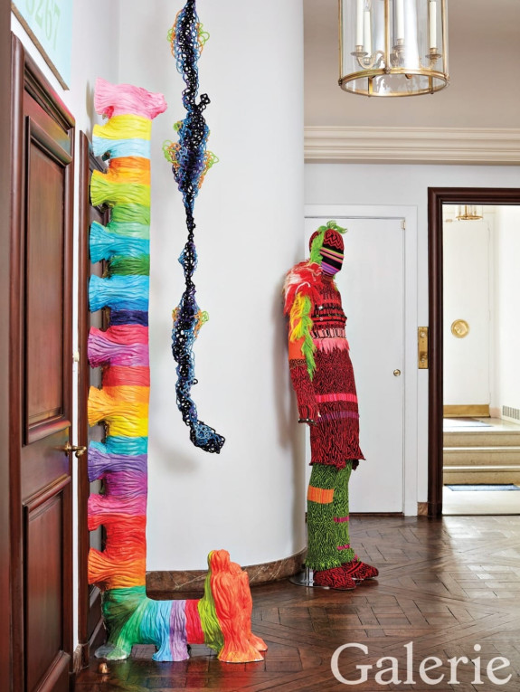 A figurative sculpture by the collective Forcefield stands in the entrance hall near a Lucky DeBellevue pipe cleaner work and the painted plaster L Dog by Ilona Rich, Schachter's wife