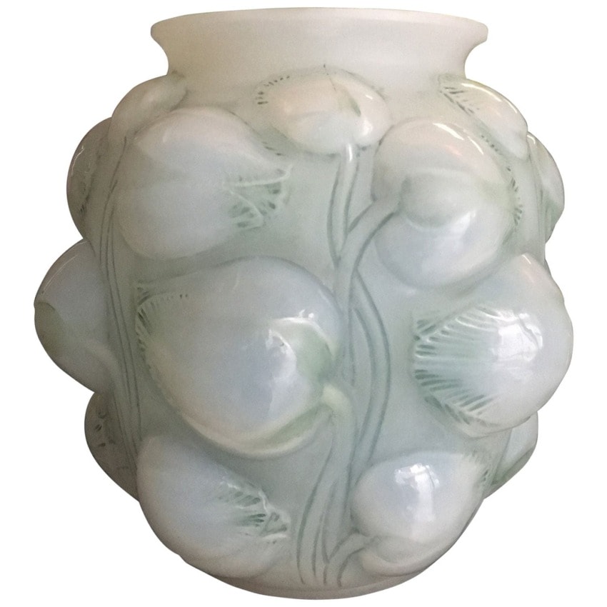 Art deco glass vase with raised floral design and soft white finish