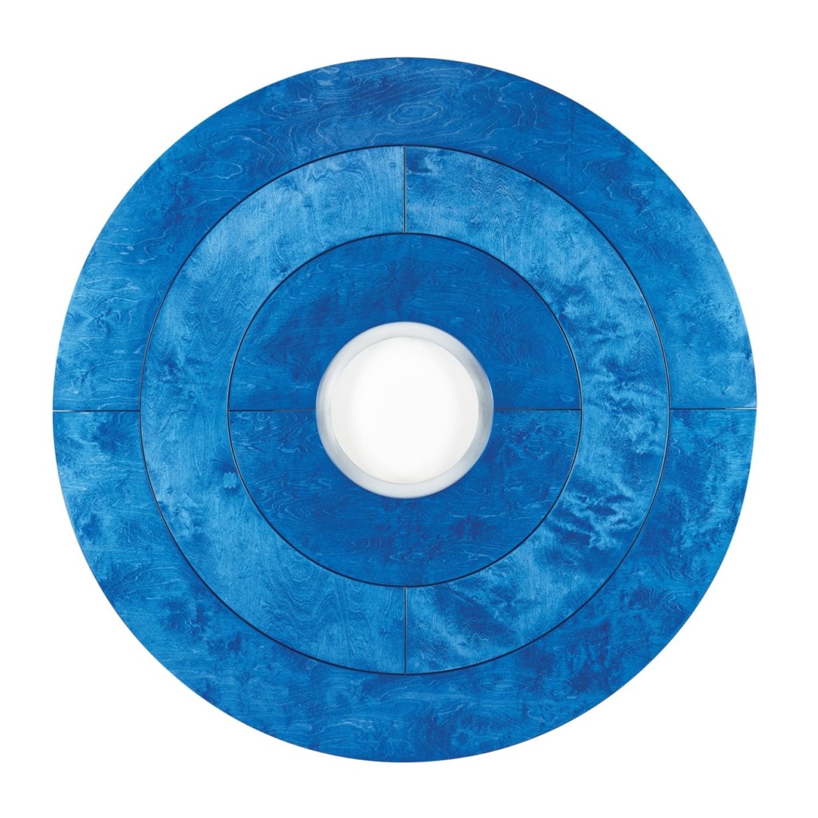 Blue concentric circular art with a textured pattern surrounding a white center.