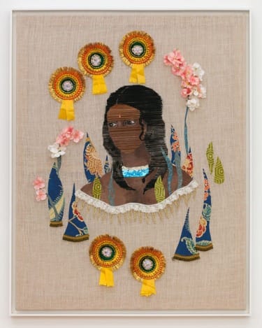 Tapestry art featuring a woman's portrait with intricate patterns and colorful embellishments on a textured fabric background.