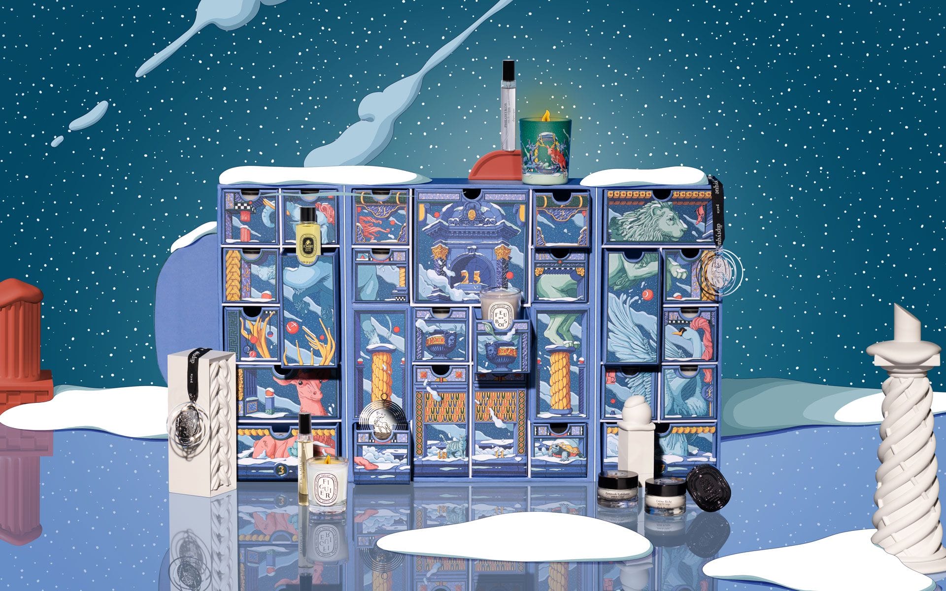 Advent calendar with colorful illustrations, luxury skincare and fragrance products on a snowy reflective surface.