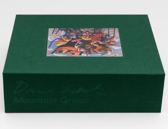Green box with an art print on top showing multiple colorful figures and abstract shapes.