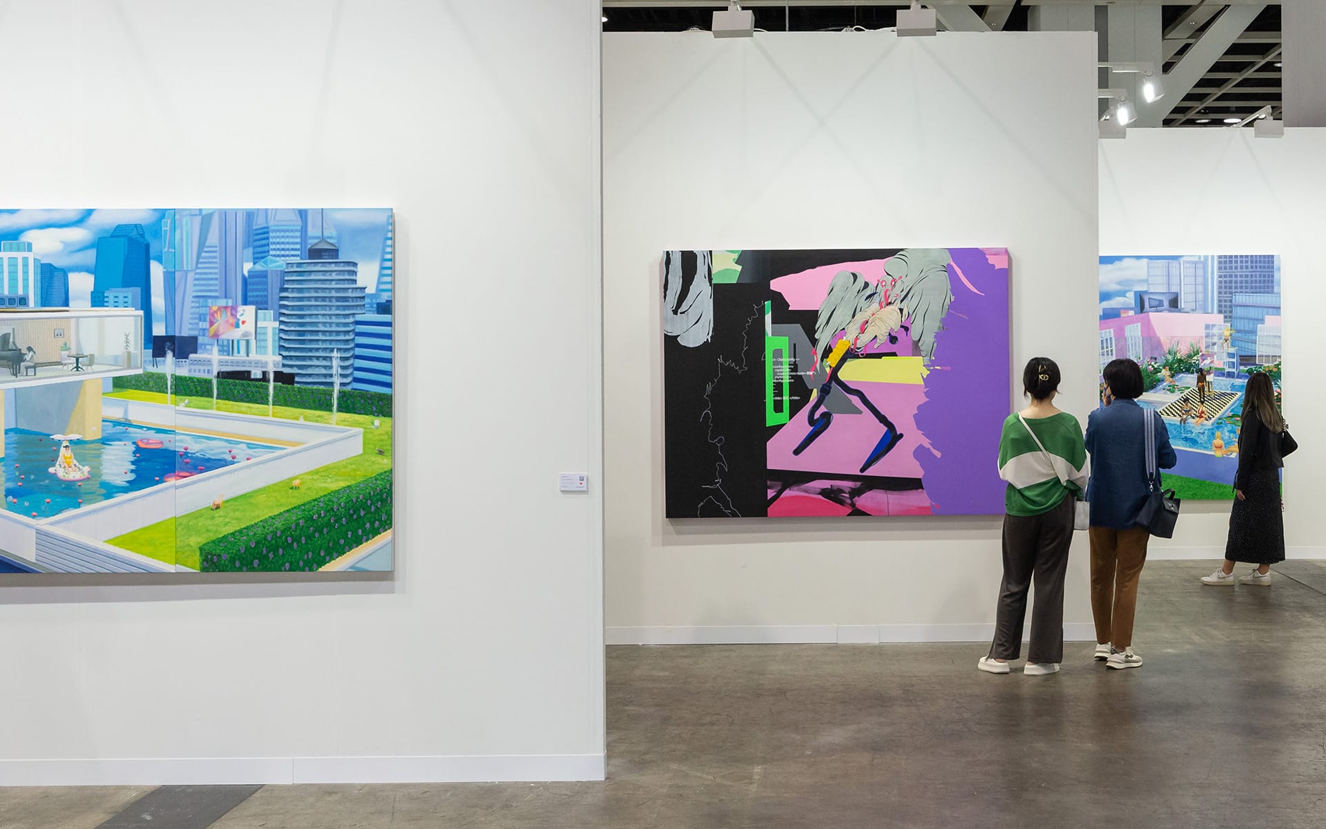 People viewing modern art paintings in a gallery setting with bright colors and urban themes displayed on the walls.