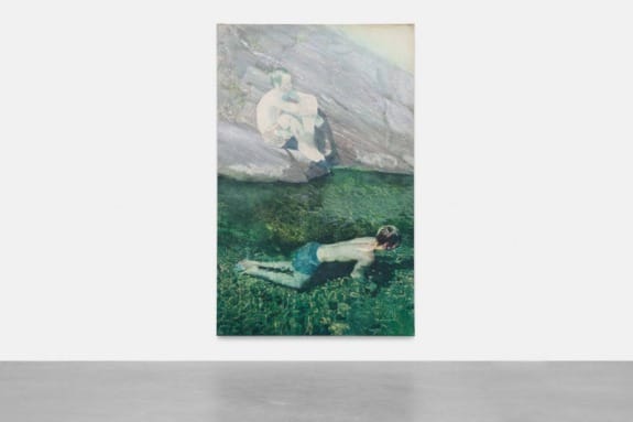 Painting of two figures in a grassy area, one sitting on rocks and the other lying down, with muted colors.