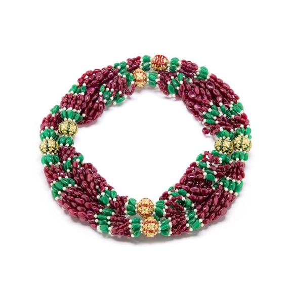 Colorful beaded necklace with red, green, and gold beads arranged in a unique pattern on a white background.