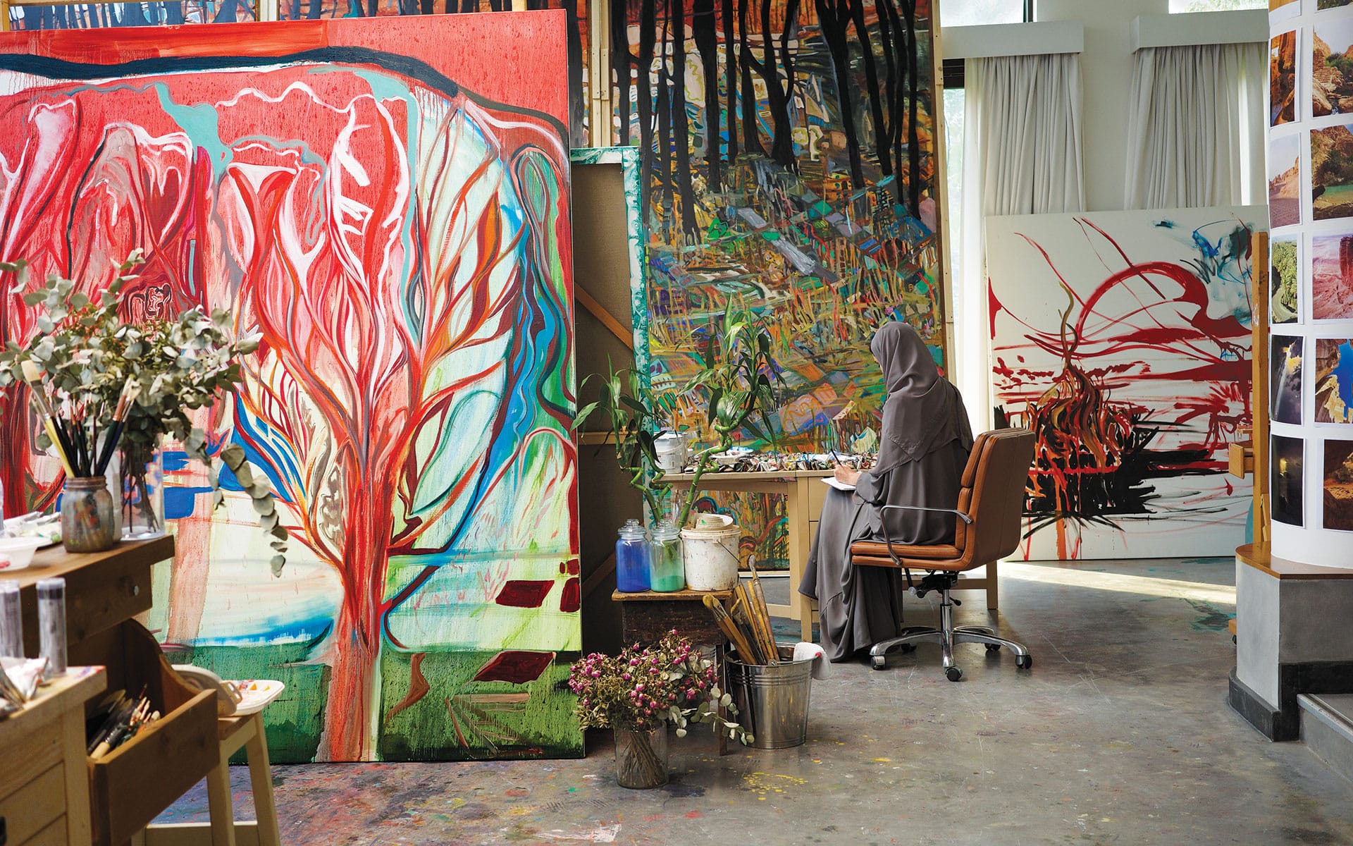 Alia Ahmad in her studio in Riyadh, Saudi Arabia, with a series of works in progress.
