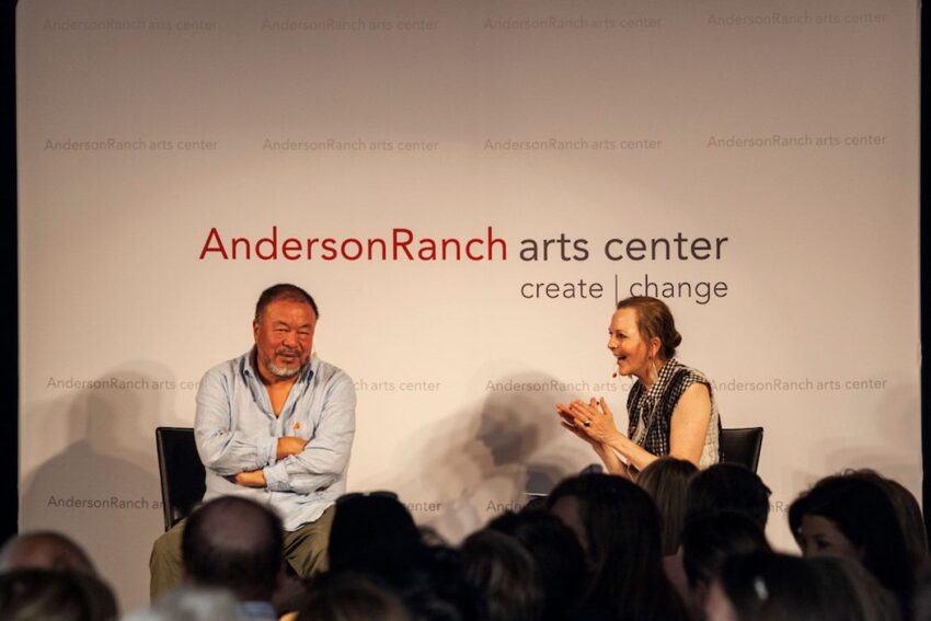 Two people seated on stage, engaged in a conversation at Anderson Ranch Arts Center event with audience in foreground.