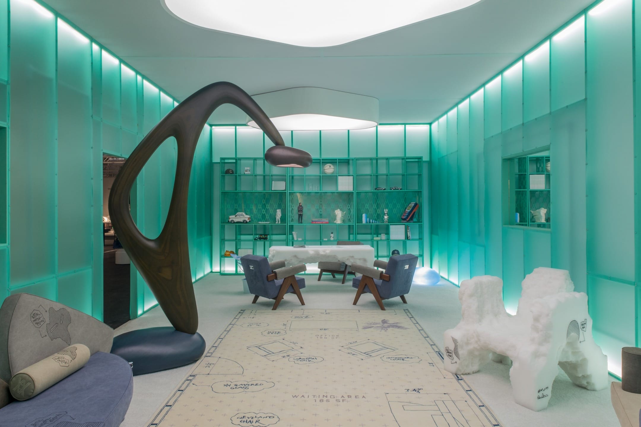Modern artistic waiting area with abstract sculpture, turquoise illuminated shelves, and unique seating arrangements.