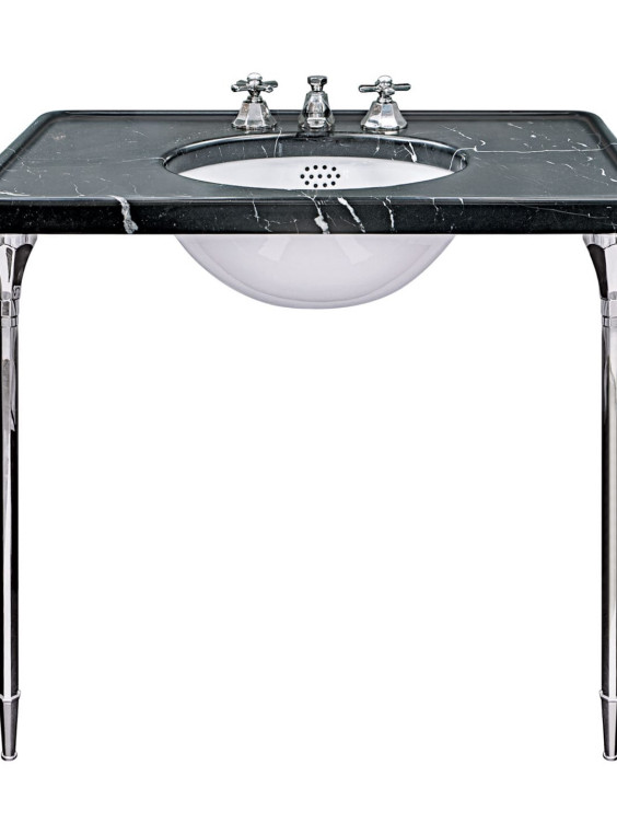 Vintage-style bathroom sink with a black marble countertop and chrome legs, featuring a white basin and silver faucet.