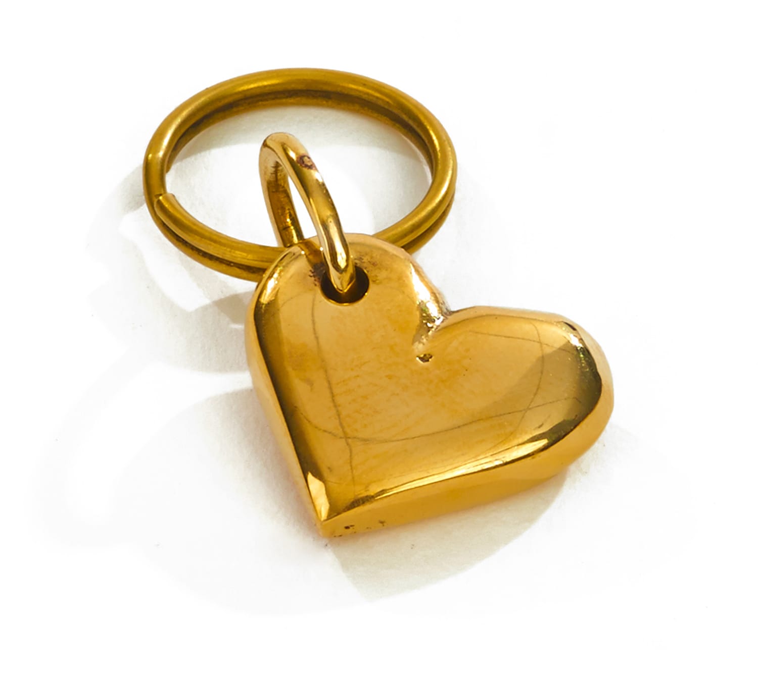 golden heart-shaped keychain on a white background