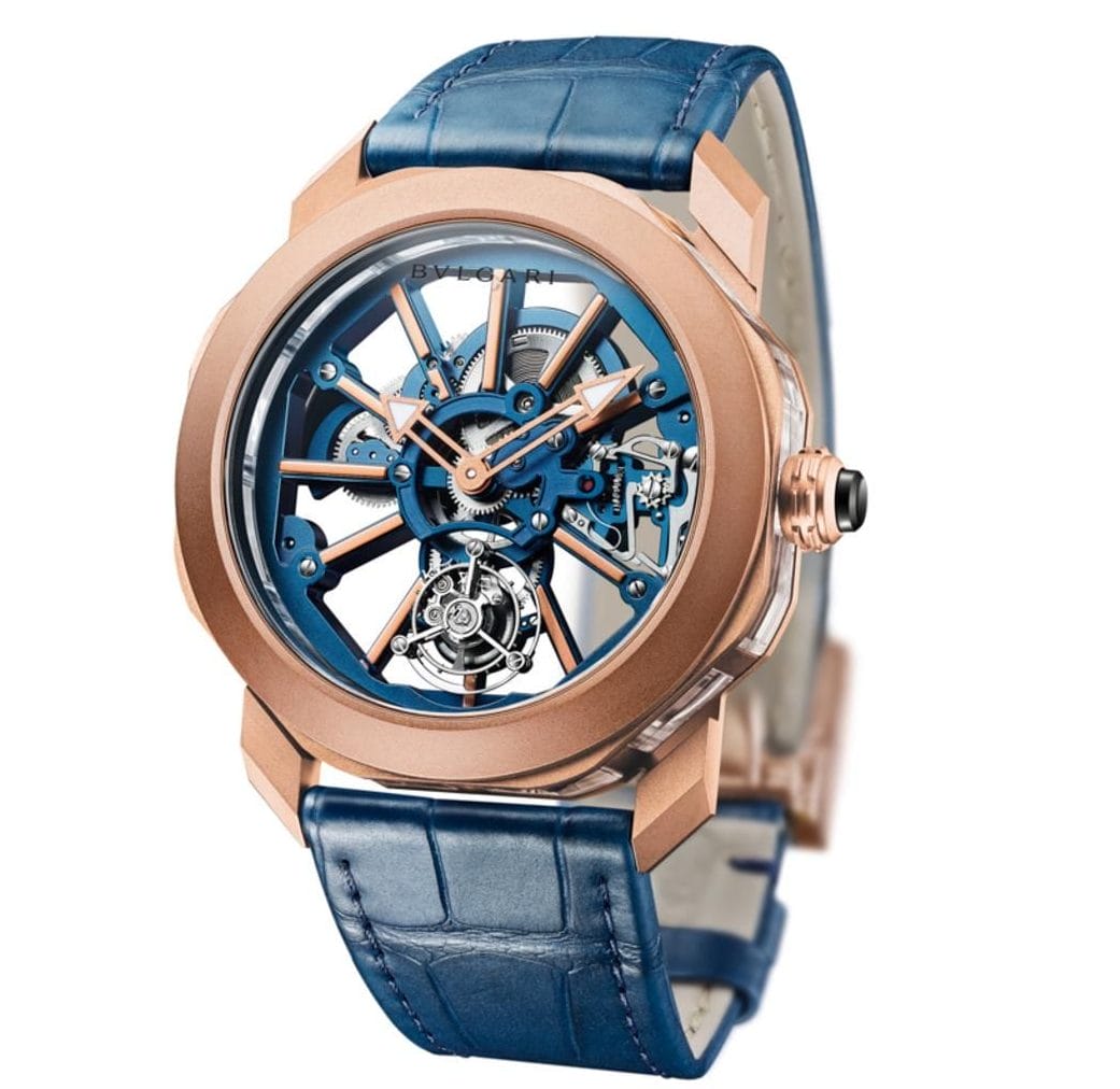 luxury watch with blue leather strap, rose gold accents, and intricate exposed mechanical design