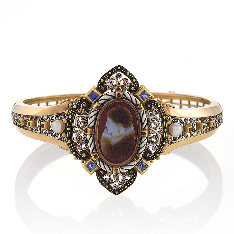 Victorian gold bracelet with intricate cameo design and ornate detailing.