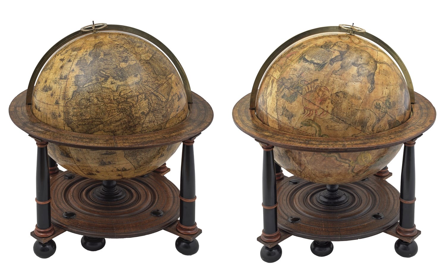 Two antique globes with detailed vintage maps on wooden stands.