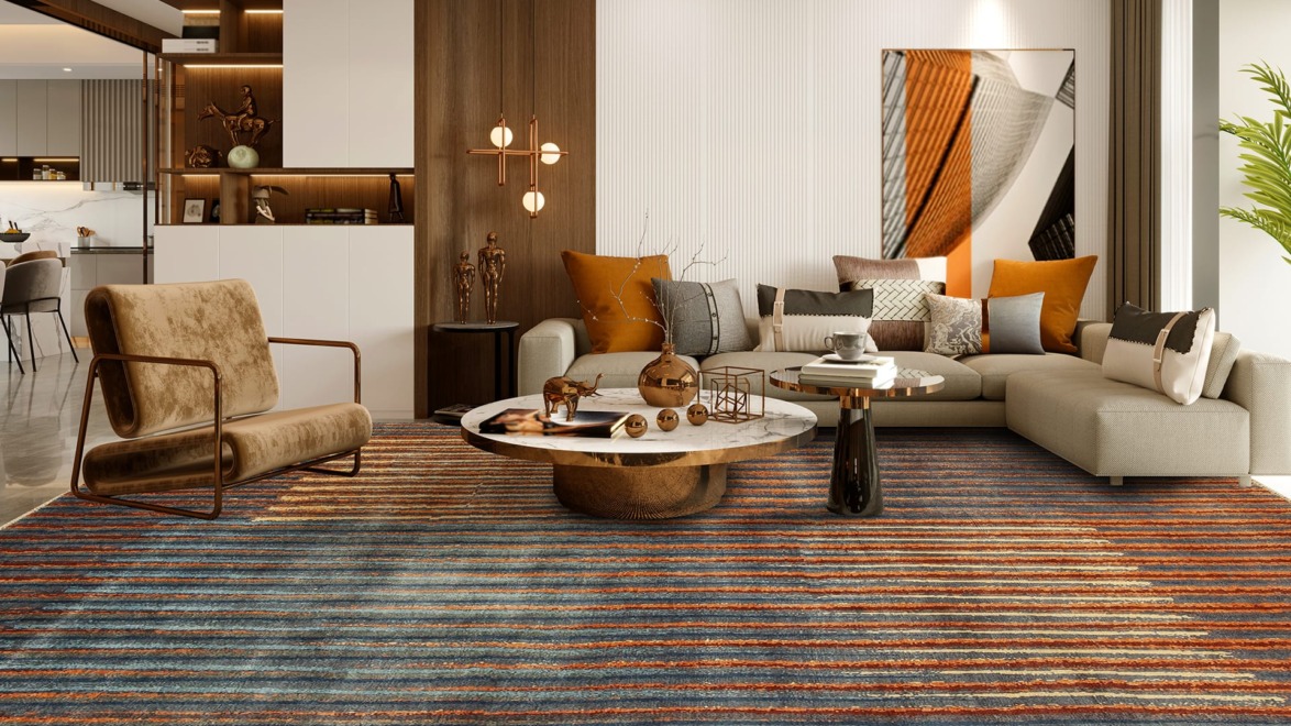 Modern living room with a sectional sofa, striped rug, and a round coffee table surrounded by stylish decor and wall art.