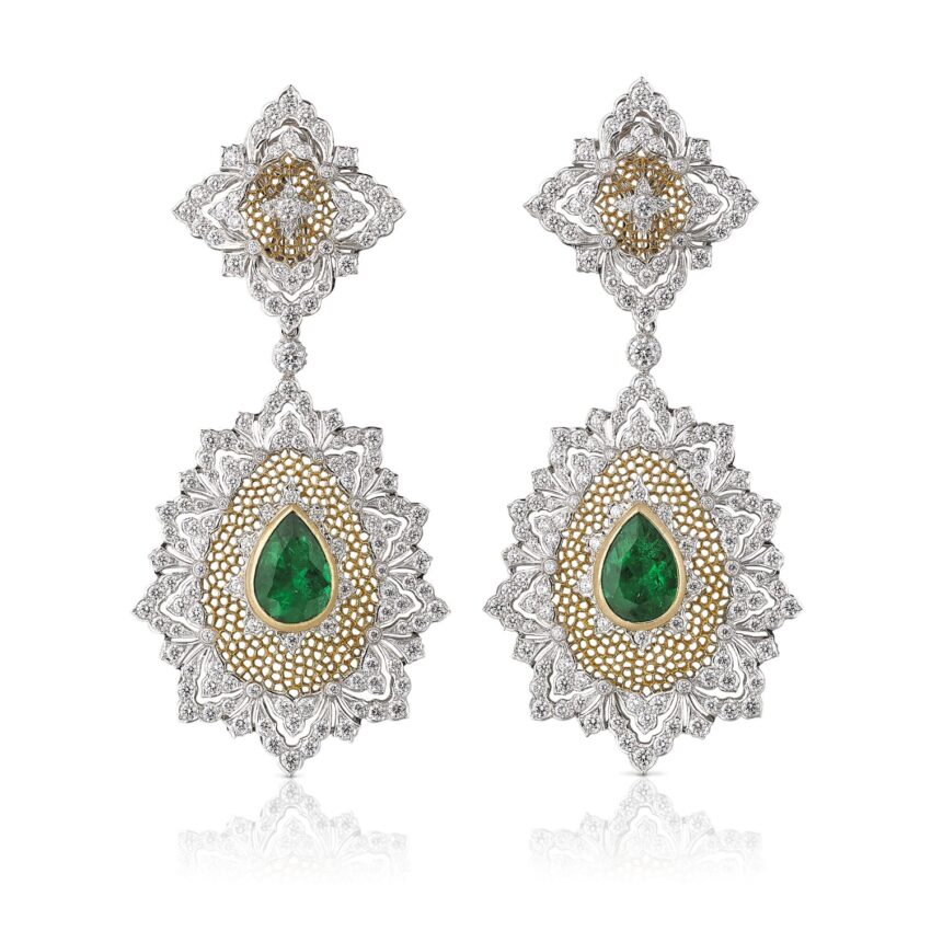Intricate silver and gold earrings with green gemstones, featuring teardrop and floral designs.