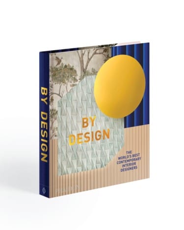 Cover of "By Design: The World's Best Contemporary Interior Designers" featuring abstract art and geometric patterns.