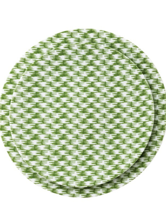 Two stacked dinner plates with a green and white houndstooth pattern on a plain white background.