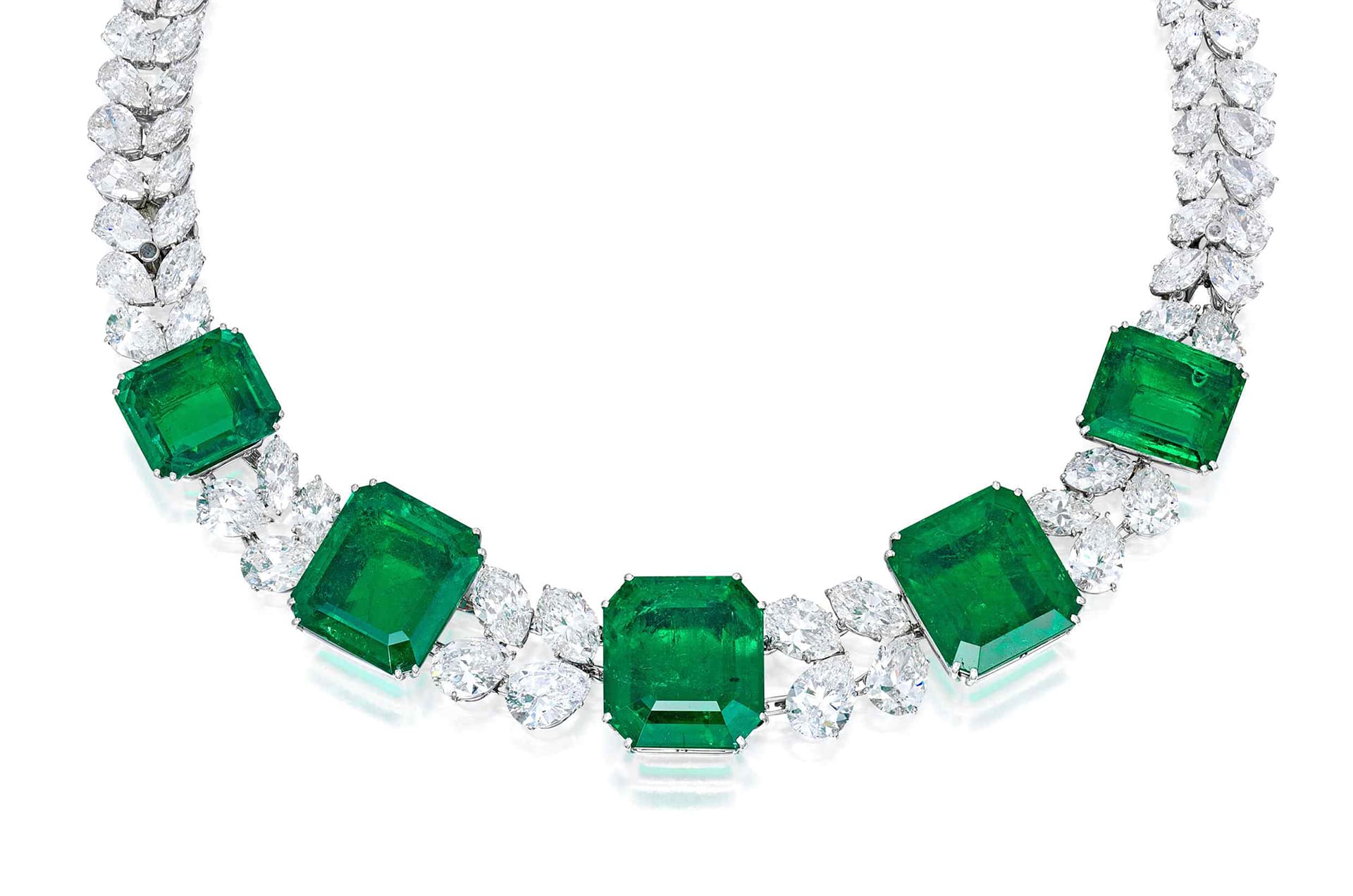 Necklace with large green gemstones surrounded by sparkling white diamonds in an elegant design.