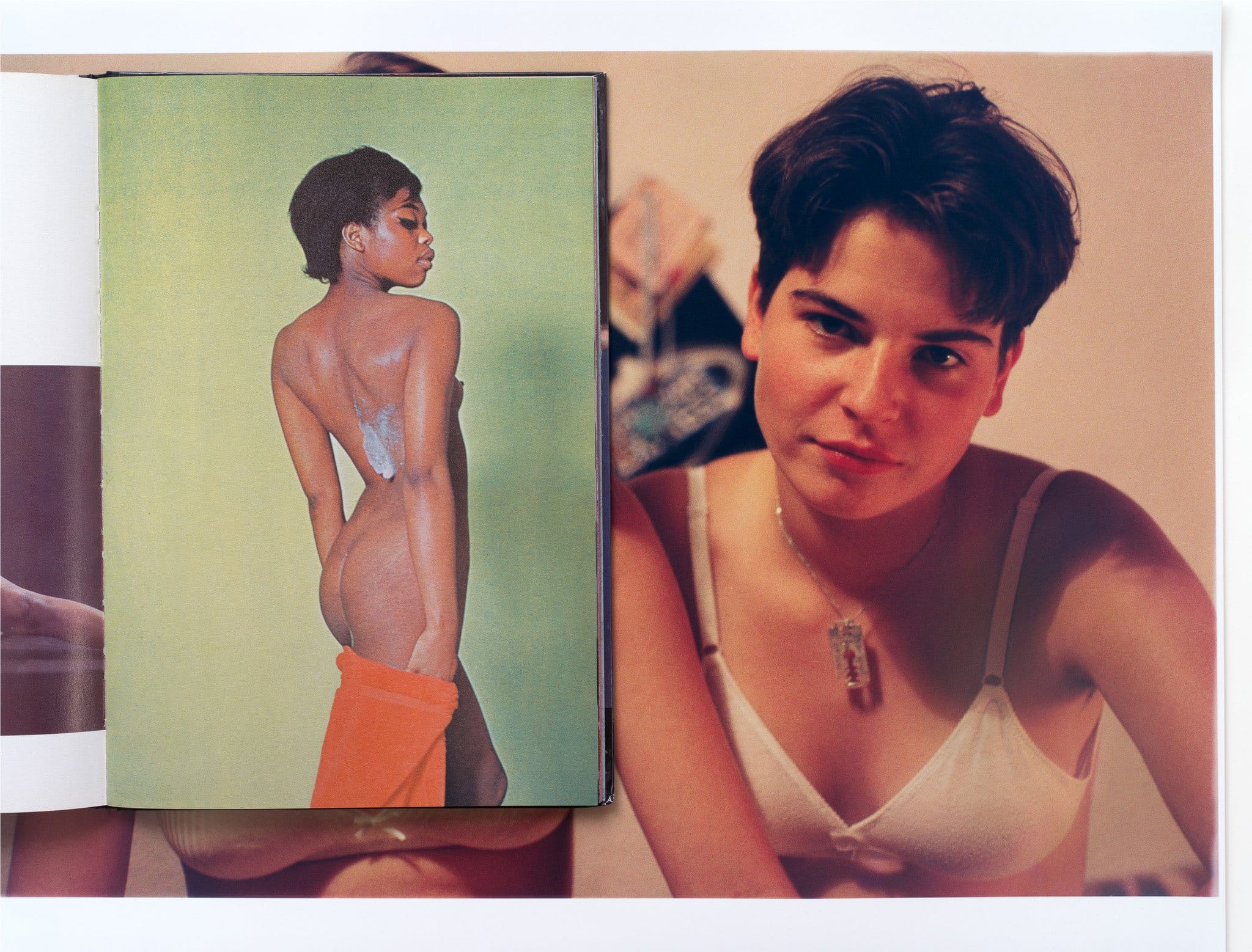 Art book open to a painting of a woman with a towel alongside a portrait of someone in a white top in the background.