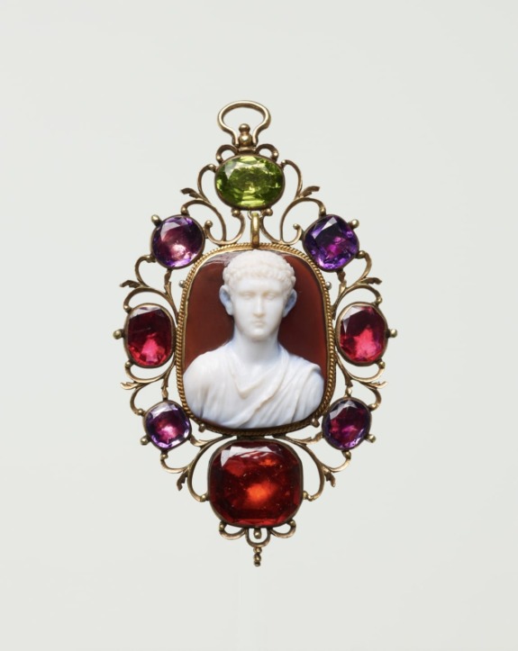 Cameo pendant with a carved portrait surrounded by multicolored gemstones in an ornate gold setting.