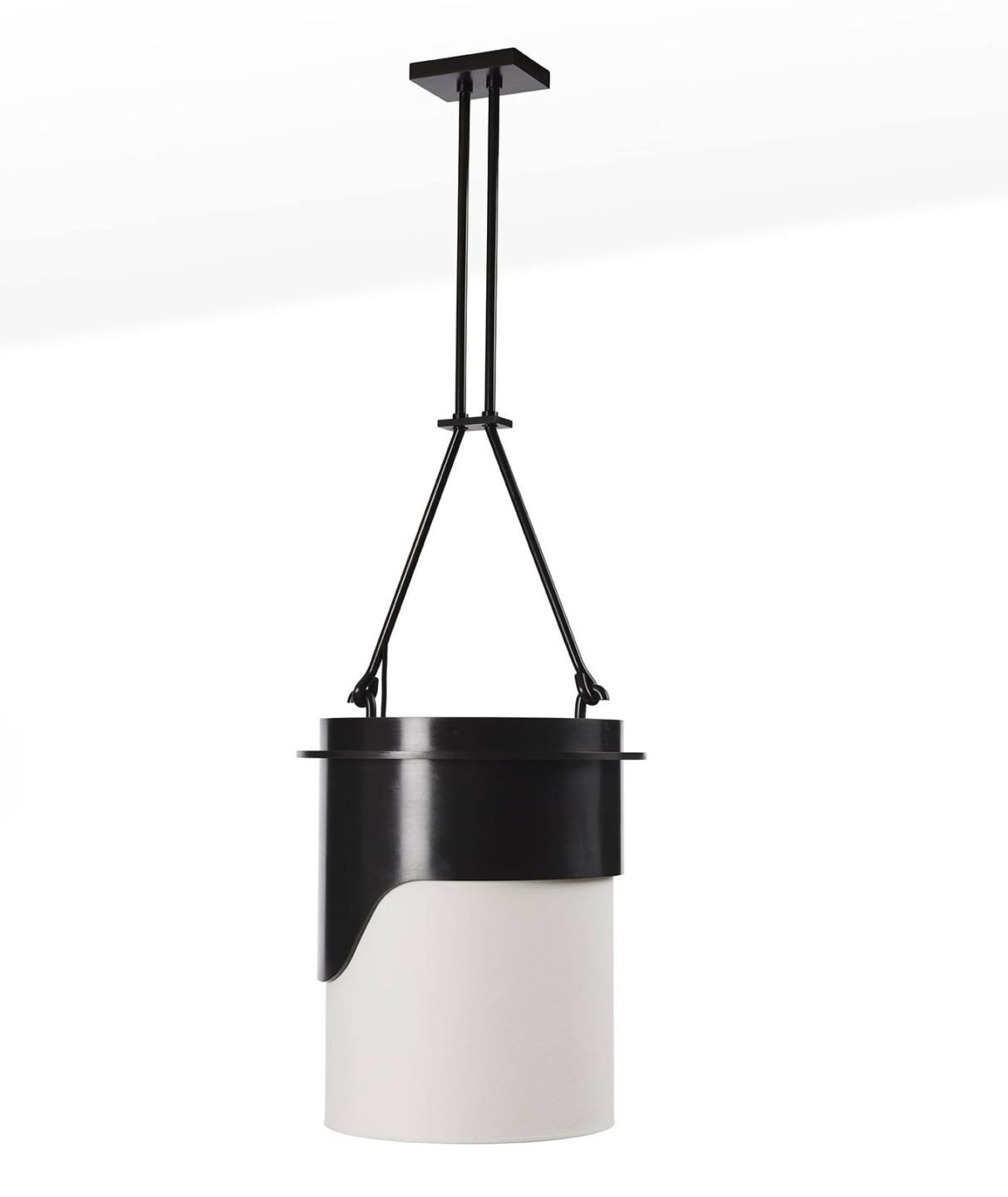 Modern black and white pendant light with geometric design hanging from ceiling fixture.