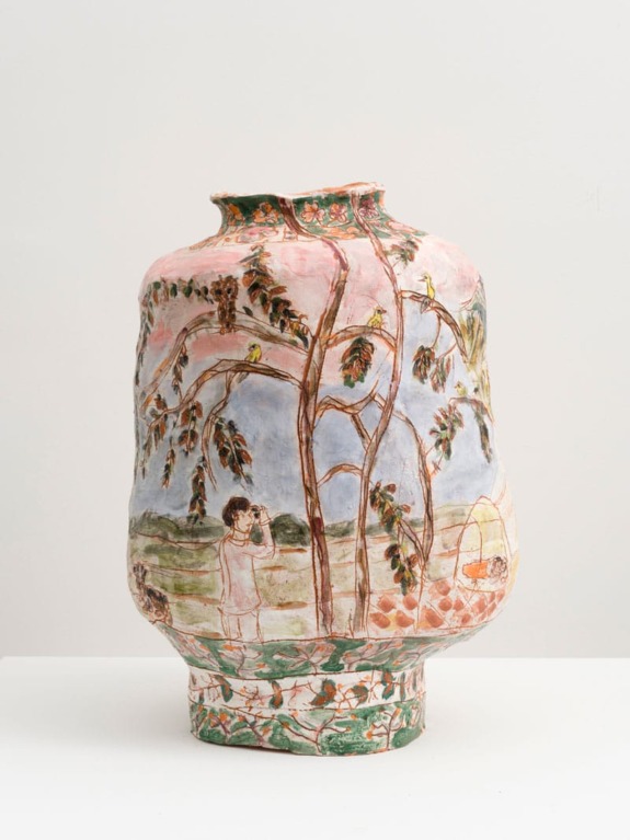 Handcrafted ceramic vase with nature scene, depicting trees, birds, and a person observing under a sky background.