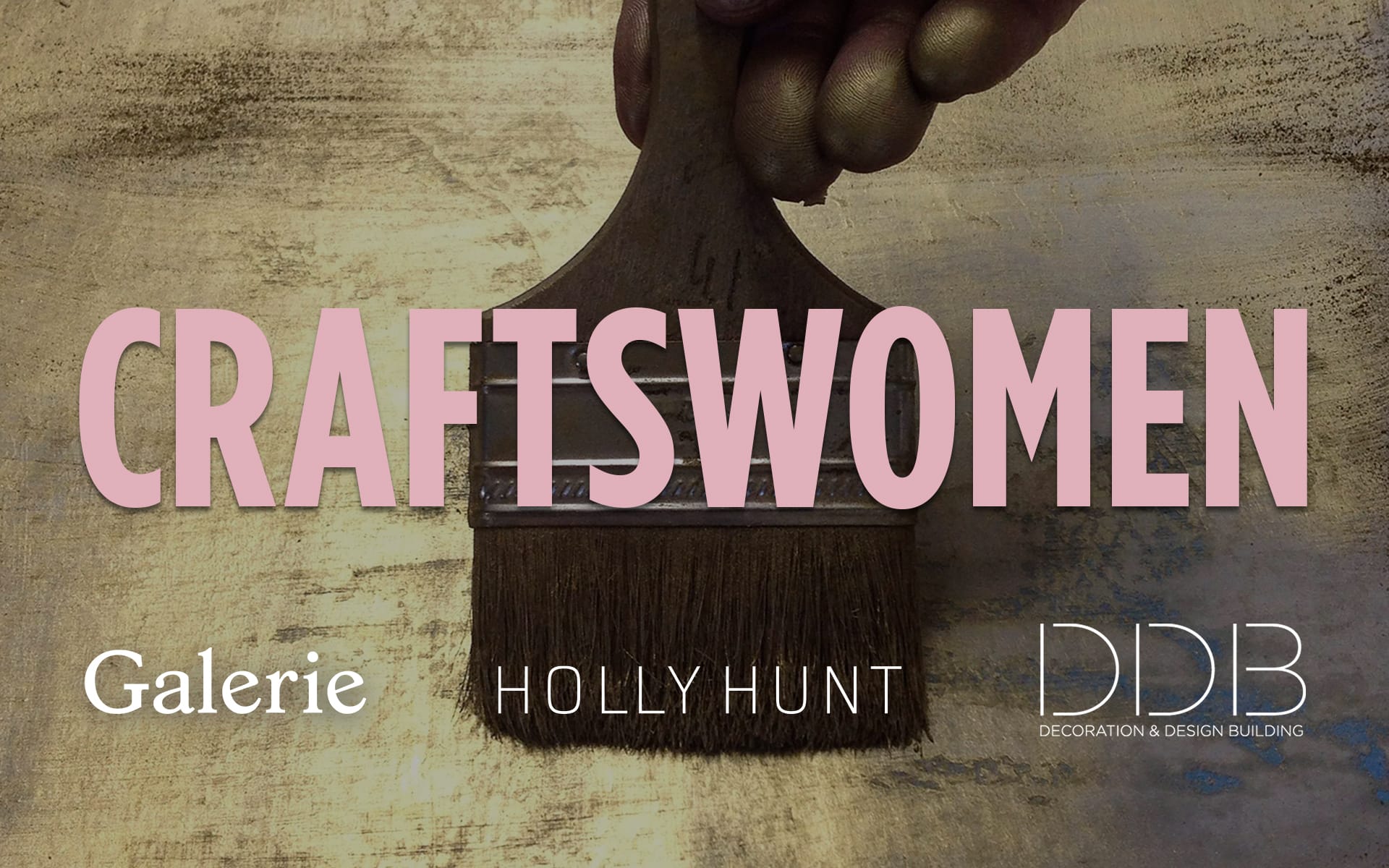 A hand holding a paintbrush on a textured surface, text reading "Craftswomen" with logos of Galerie, Holly Hunt, and DDB.
