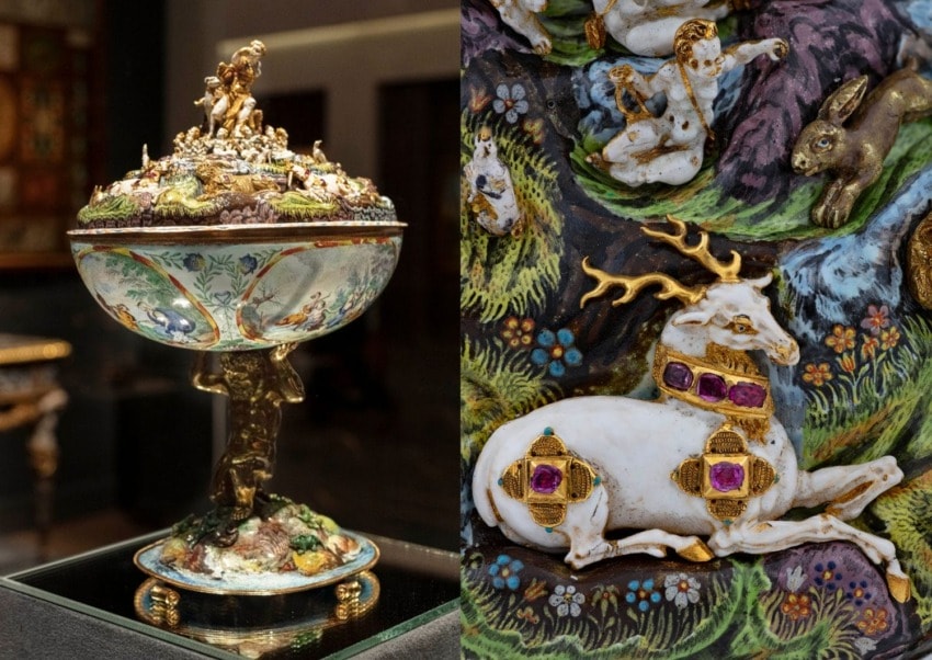 Intricately detailed ornamental cup with relief carvings of animals and figures, showcasing fine artistry and craftsmanship.