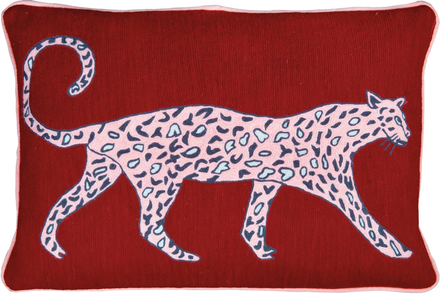 Red cushion with an embroidered pink and black leopard design.