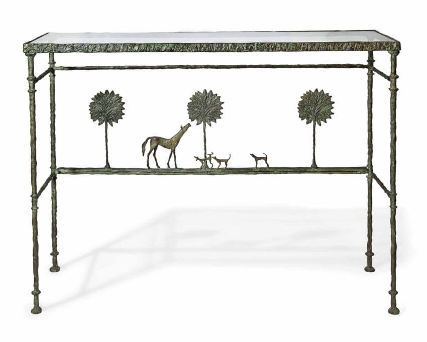Bronze console table with animal and tree design under a clear glass top.
