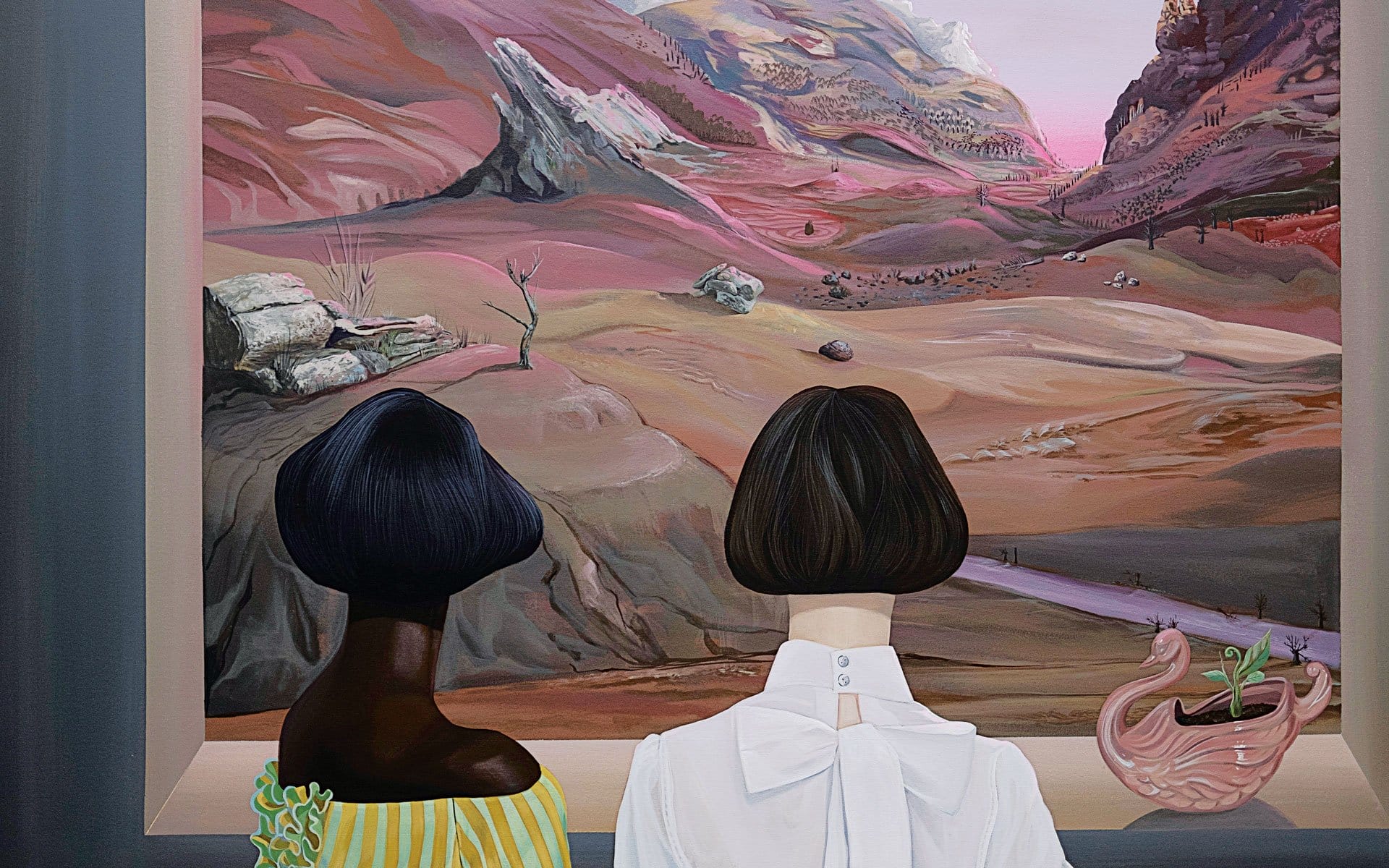 Two women with bob haircuts view a surreal landscape painting, featuring pink and rocky hills, indoors near a decorative vase.