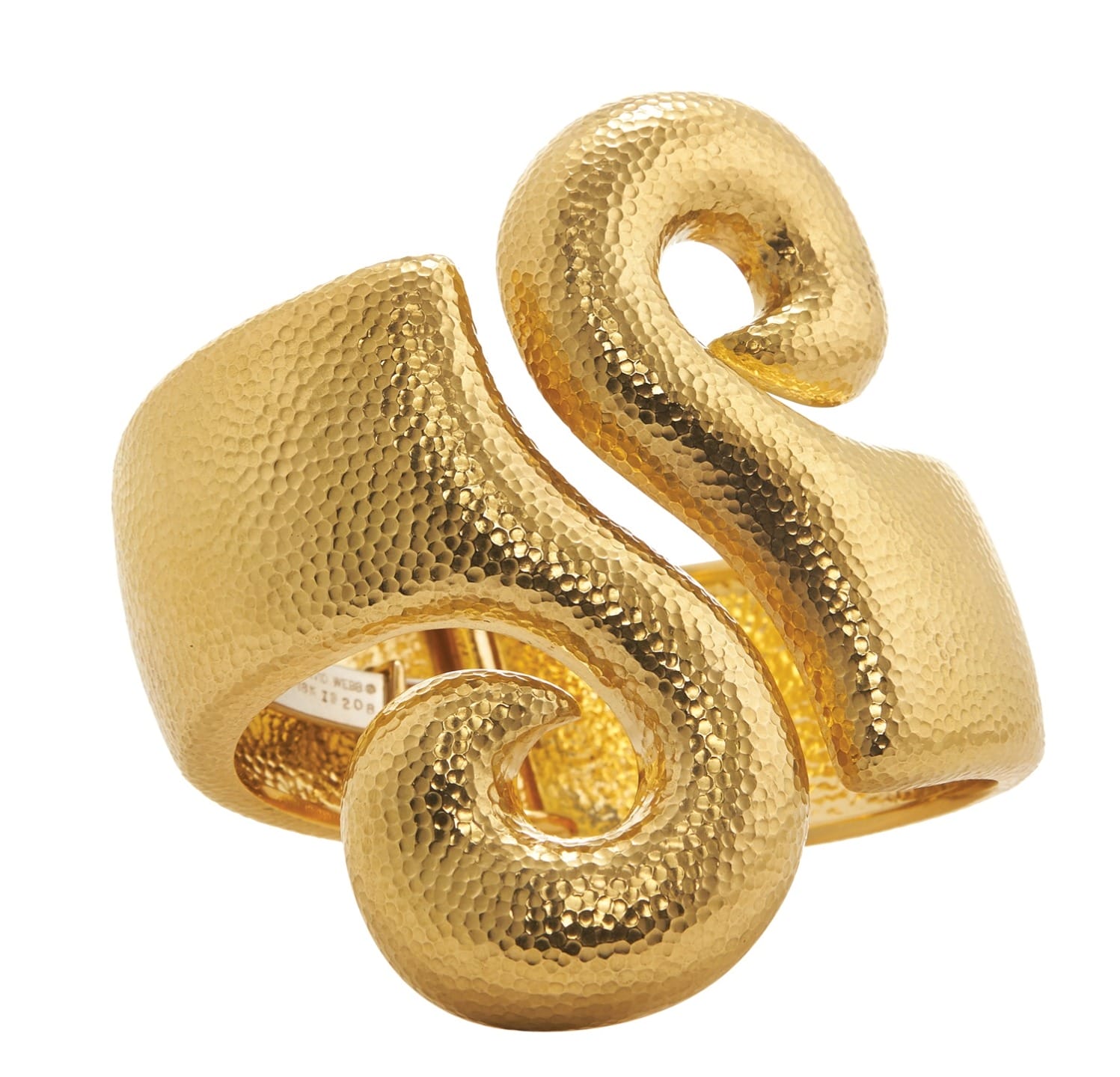 Gold textured cuff bracelet with an abstract swirl design against a white background.