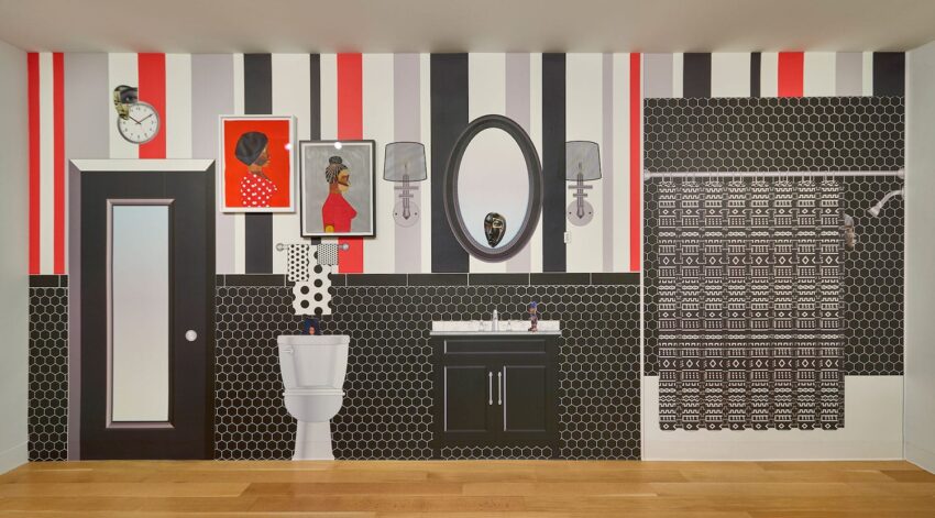 Bathroom with striped walls, graphic art, black vanity, and a black-and-white geometric shower curtain.