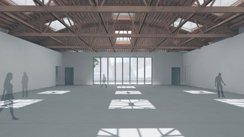 Spacious empty room with wooden beam ceiling and large windows casting light patterns on the floor, silhouettes of people inside.