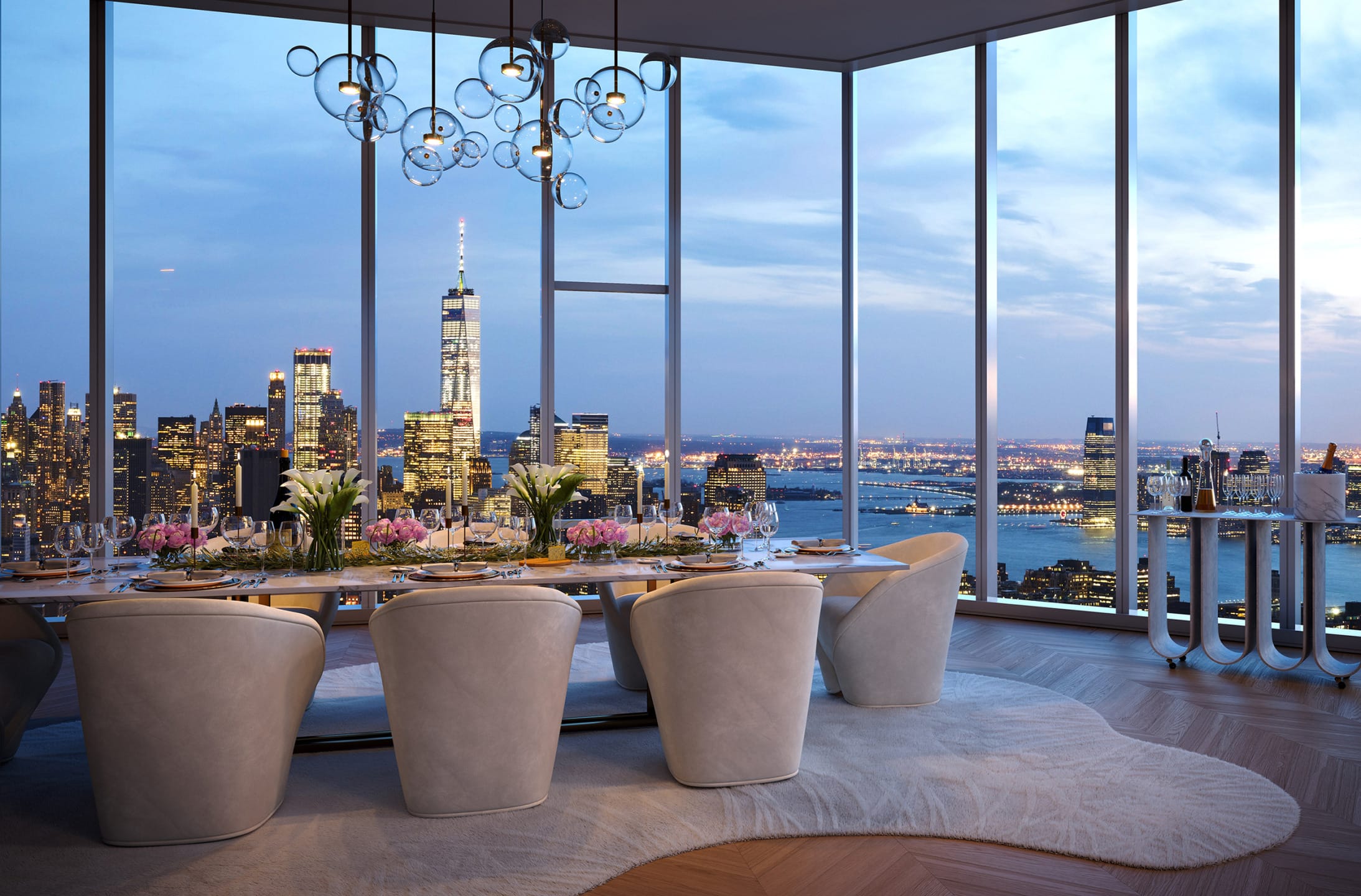 Luxury dining room with modern decor, large chandelier, and panoramic city view through floor-to-ceiling windows at dusk.