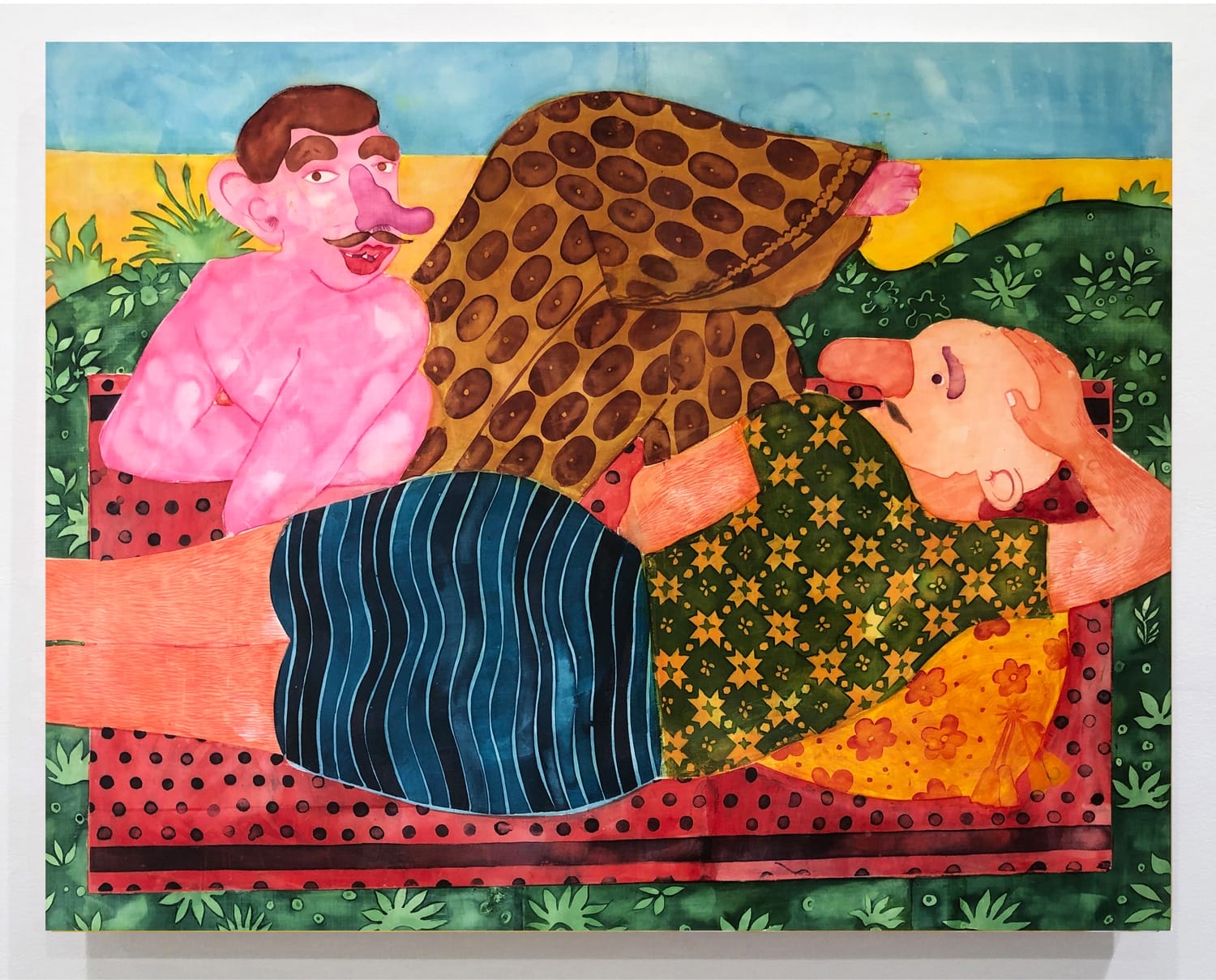 Colorful artwork of two abstract figures relaxing on a patterned surface, surrounded by vibrant colors and patterns.