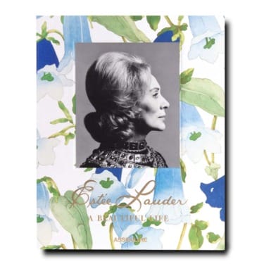 Book cover with a black and white portrait of a woman, surrounded by colorful floral design and the title "Estée Lauder A Beautiful Life"