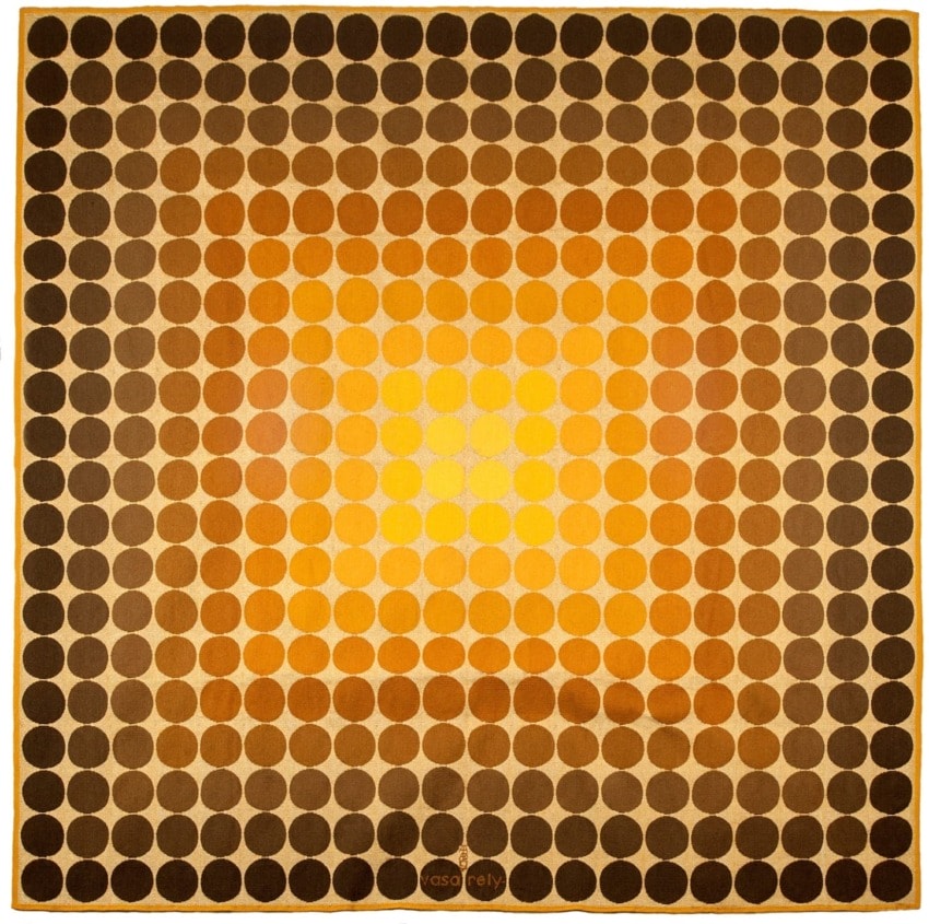 Abstract pattern with concentric circles in warm tones of orange, yellow, and brown, creating a gradient effect.