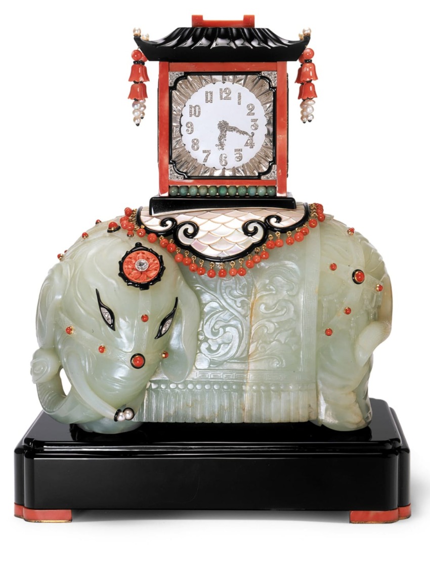 Art Deco style clock with jade elephant base, black and red accents, pearl ornaments, and intricate carvings.