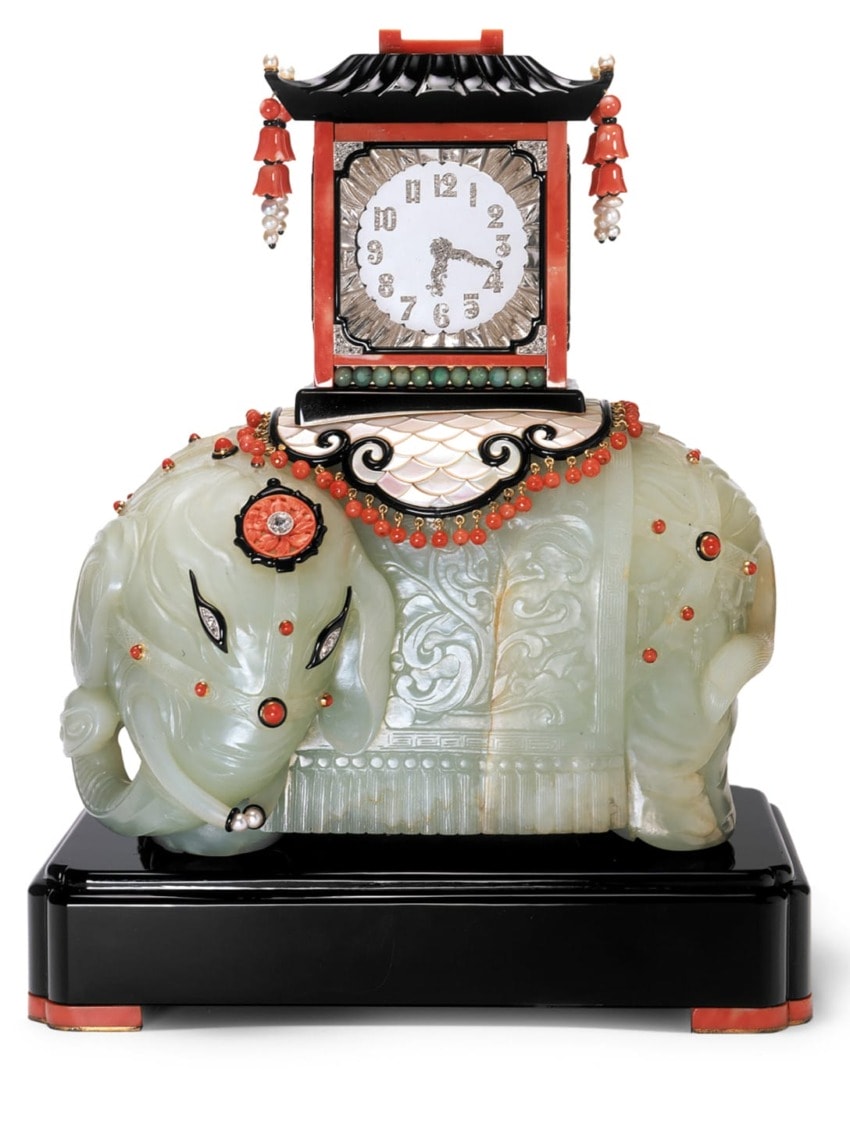 Art Deco style clock with jade elephant base, black and red accents, pearl ornaments, and intricate carvings.