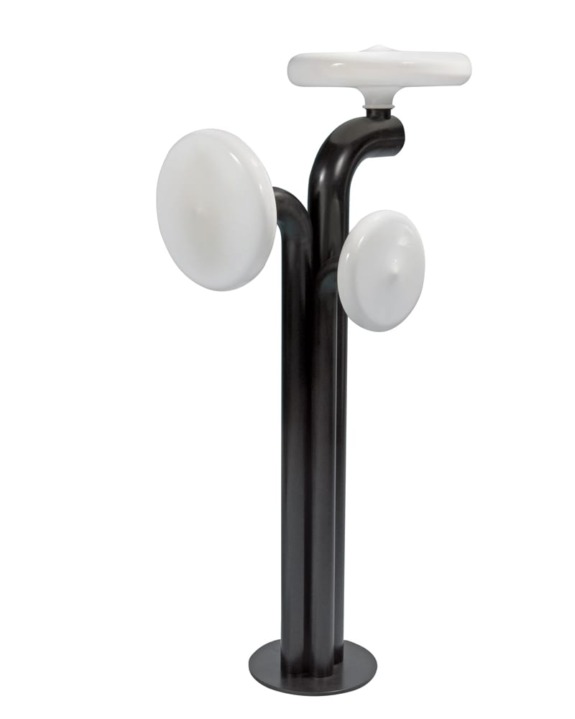 Modern abstract sculpture with a black base and white spherical elements, resembling a contemporary art design installation.